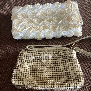 Two women’s clutch purses, metallic and taffeta roses, nice evening out.